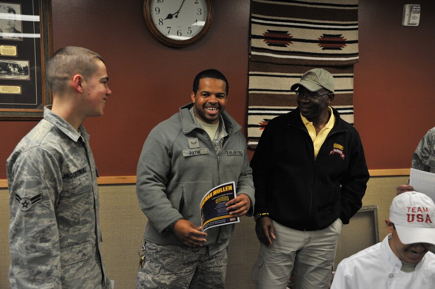 Retired Army Master Sgt. Howard "Mad Max" Mullen listens to Airmen 1st Class Kyle Jogodzinski, 741st Missile Security Forces Squadron fire team member, and Ryan Payne, 741st MSFS member, talk about being a security forces members . (U.S. Air Force photo/John Turner)