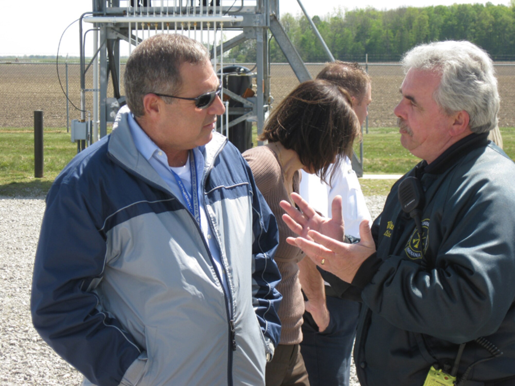 GRISSOM AIR RESERVE BASE, Ind., -- Dr. Michael Harris, honorary 434th Air Refueling Wing commander, is briefed by Mr. William Dixon, chief of training, on Grissom fire department procedures.  Dr. Harris, along with five other honorary commanders, toured mission support group agencies during a recent base visit.  One of the stops included the outdoor fire training area.  (U.S. Air Force photo/Lt. Col. Gary Lockard)                            