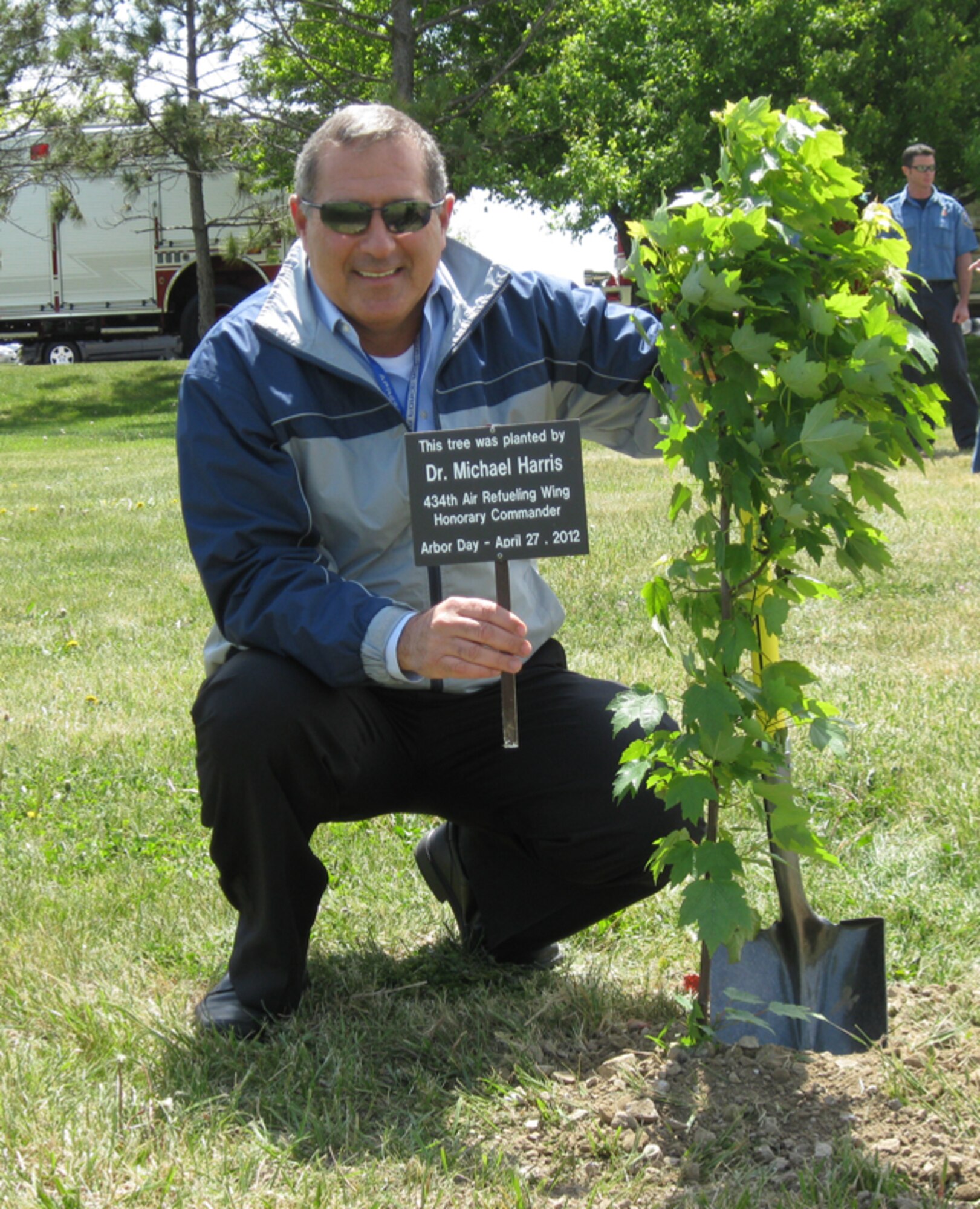GRISSOM AIR RESERVE BASE, Ind., -- Dr. Michael Harris, honorary 434th Air Refueling Wing commander, proudly displays the marker that goes along with the tree he planted during the recent Arbor Day ceremony at Grissom.  Dr. Harris,  along with five other honorary commanders, participated in the ceremony which recognized Grissom's commitment to the environment and its designation as a "Tree City USA" by the National Arbor Day Foundation (U.S. Air Force photo/Lt. Col. Gary Lockard)