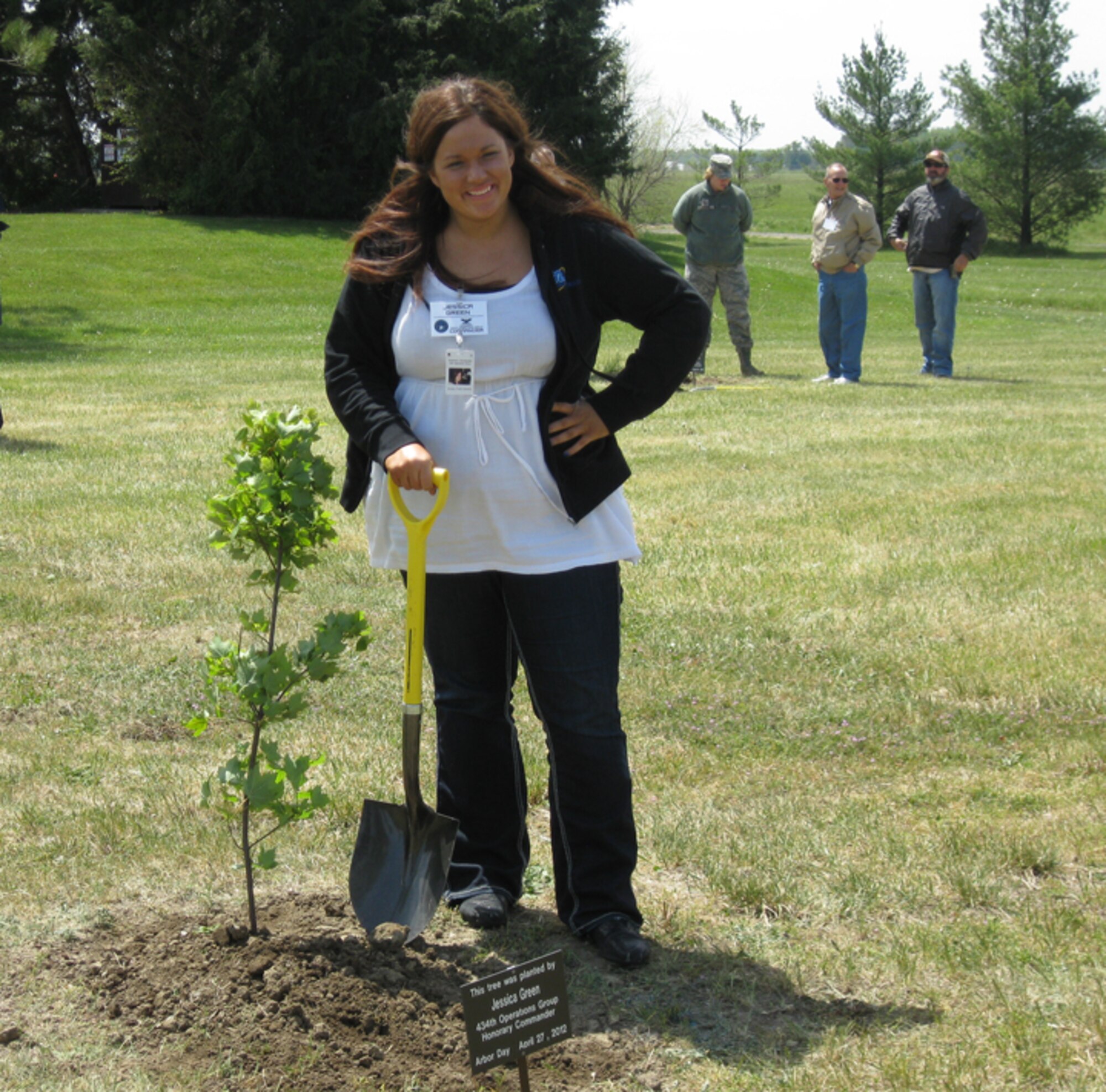GRISSOM AIR RESERVE BASE, Ind., -- Jessica Green, honorary 434th Operations Group commander, take a quick break after planting a tree at the recent Arbor Day ceremony at Grissom.  Ms Green, along with five other honorary commanders, participated in the ceremony which recognized Grissom's commitment to the environment and its designation as a "Tree City USA" by the National Arbor Day Foundation (U.S. Air Force photo/Lt. Col. Gary Lockard                                                                         