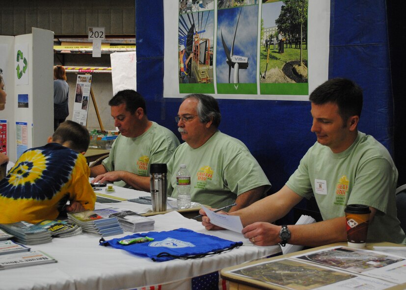 From left to right, 341st Civil Engineer Squadron members Steven McSwain, hazardous waste disposer, Donald Delorme, environmental protection specialist, and Jason Gibbons, biologist, interact with visitors at their booth during Great Falls' Earth Day and Science, Technology, Engineering and Math exposition at the Great Falls Fieldhouse April 21. (U.S. Air Force photo/Airman 1st Class Katrina Heikkinen)