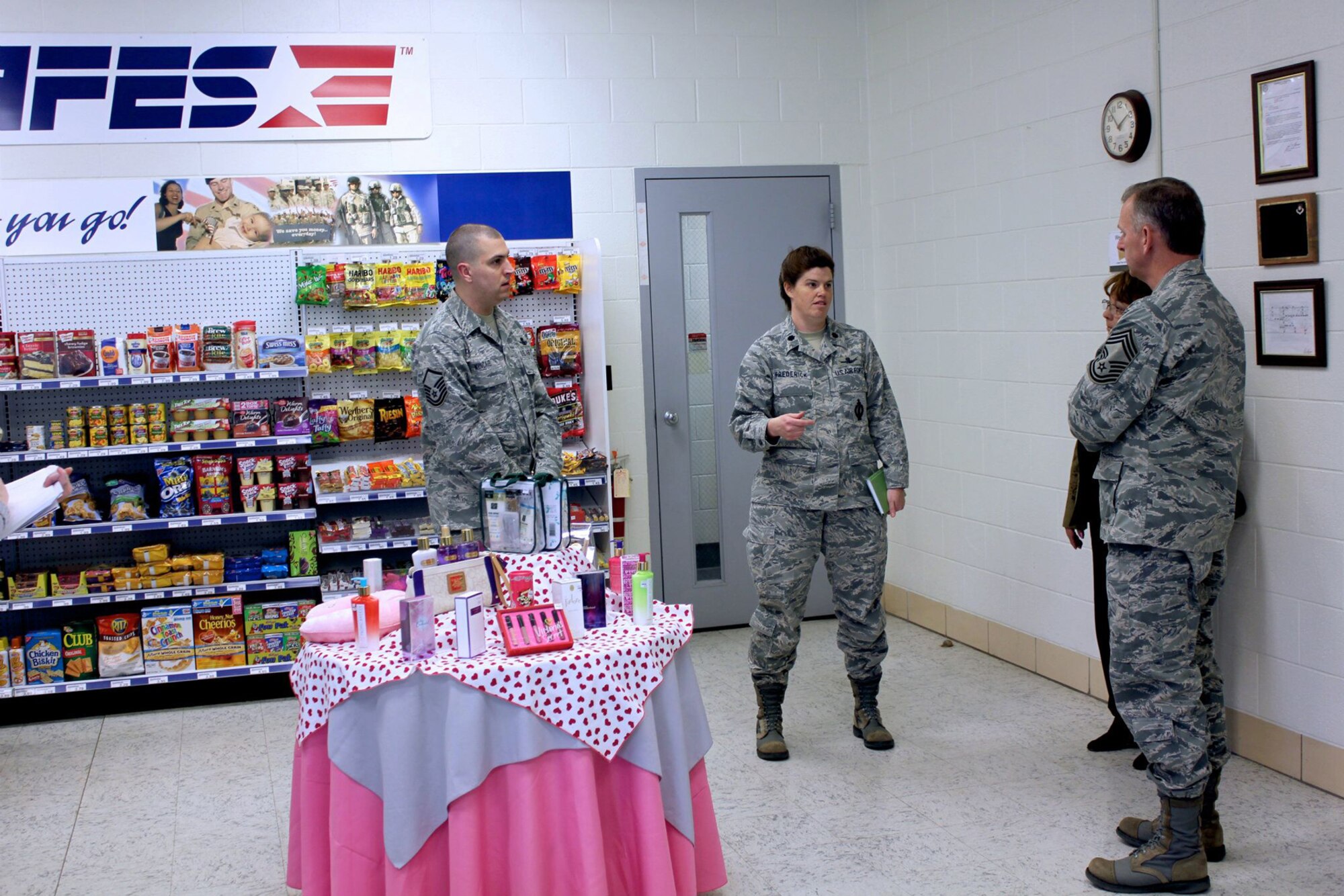 CAVALIER AIR FORCE STATION, N.D. – Lt. Col. Lorinda Frederick (second from left), 10th Space Warning Squadron commander, briefs Chief Master Sgt. Jeffry Helm (right), senior enlisted advisor for the Army & Air Force Exchange Service, April 18 at Cavalier AFS. Helm is one of 72 active duty servicemembers assigned to the exchange to find out what the exchange can do to better serve its customers and fix existing problems. (U.S. Air Force photo/Capt. Jesse Diaz)