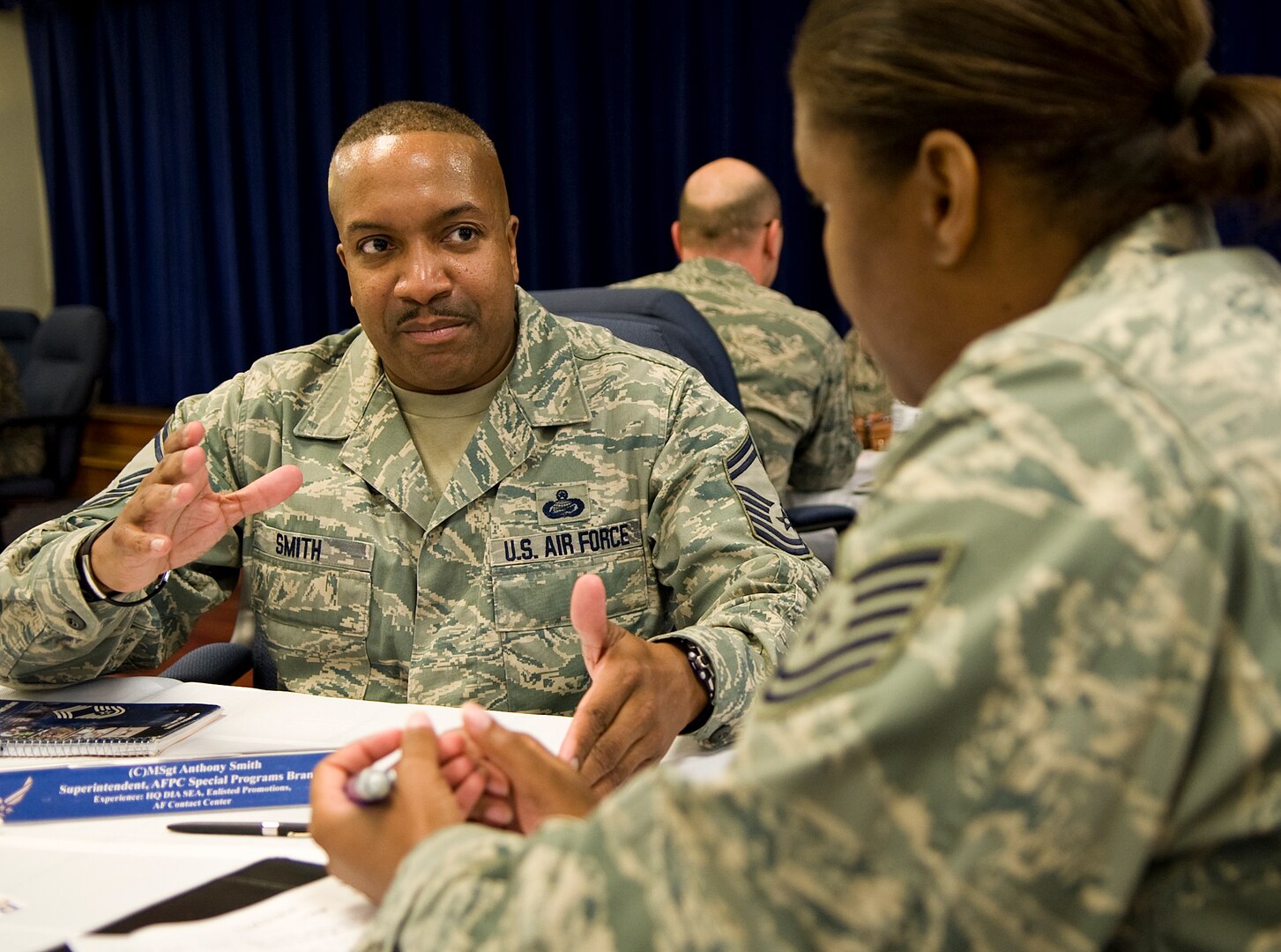 Tech Sgt. Jamie Dukes, Air Force Personnel Center Retirement Total Force Service Center-San Antonio NCOIC, discusses the future direction of the Air Force with Senior Master Sgt.  Anthony Smith, AFPC Superintendent Special Programs Branch, at the speed mentoring seminar hosted by the Rising 5/6  April 25 at Joint Base San Antonio-Randolph. (U.S. Air Force photo by Benjamin Faske)