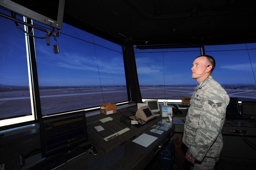 Senior Airman Shawn Hanger, 56th Operations Support Squadron Air Field Operations Flight air traffic controller, watches the tower radar display, which shows all aircraft within 25 nautical miles of the base. Luke Ar Force Base air traffic controllers monitor and interact with more than 350 aircraft every day.   (U.S. Air Force photy by Senior Airman Sandra Welch)