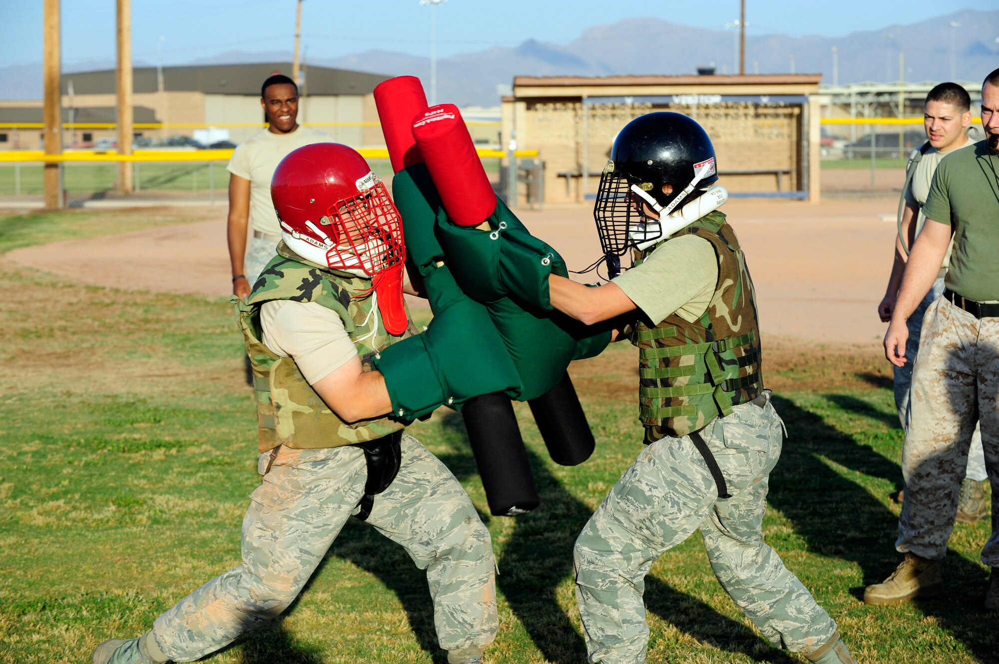 Staff Sgt. Charles Storr, 607th Air Control Squadron, spars with Staff Sgt. Jamie Ciciora, 56th Fighter Wing Public Affairs, during the Marine Corps Martial Arts Program at Luke Air Force Base. Participants in MCMAP learn close combat fighting techniques, basic weapons movements, and character, mental and physical disciplines.  (U.S. Air Force photy by Staff Sgt. Jason Colbert)