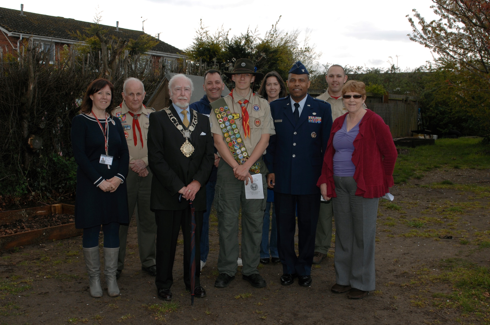 THETFORD, England -- Isaiah Roehm, Boy Scouts of America Troop 219 (center), stands by with Councillor Derek Mortimer, Mayor of Thetford, and other distinguished guests at the Raleigh Nursery and Junior School April 24, 2012.  Roehm devoted his Eagle Scout project to clean-up a gardening area, construct gardening boxes and install a water collection system at the school. Members from the 48th Medical Group and the Lakenheath High School Junior Reserve Officer Training Corps assisted with the funding and completion of the project.  (U.S. Air Force photo by Tech. Sgt. Lee A. Osberry Jr.)