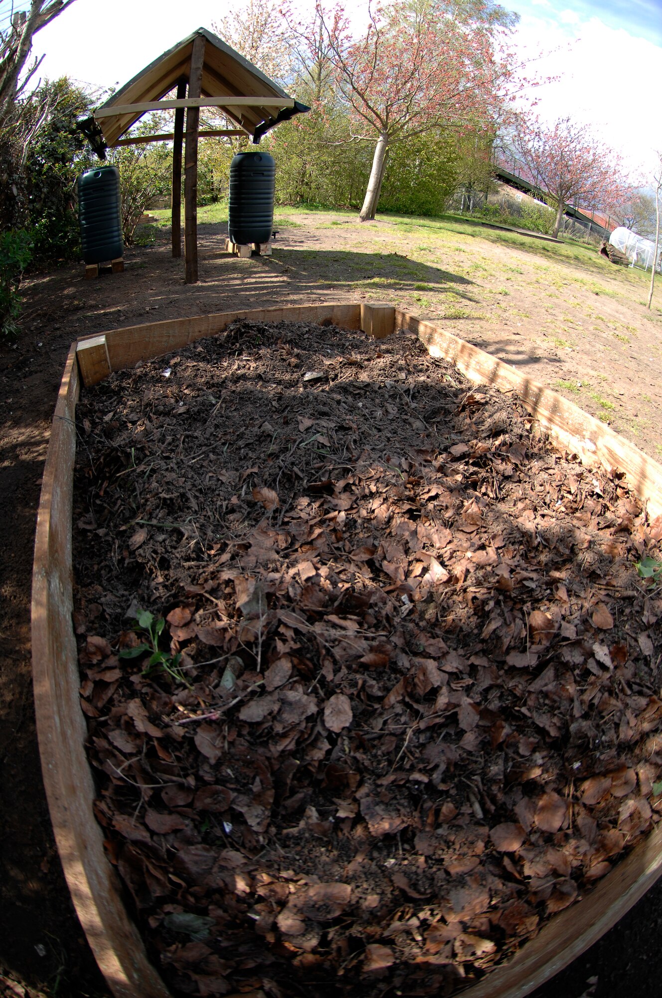 THETFORD, England -- Members from the 48th Medical Group teamed with Boy Scouts of America Troop 219, and the Lakenheath High School Junior Reserve Officer Training Corps to clean-up a gardening area, construct gardening boxes and install a water collection system.  The garden was officially reopened April 24, 2012.  (U.S. Air Force photo by Tech. Sgt. Lee A. Osberry Jr.)