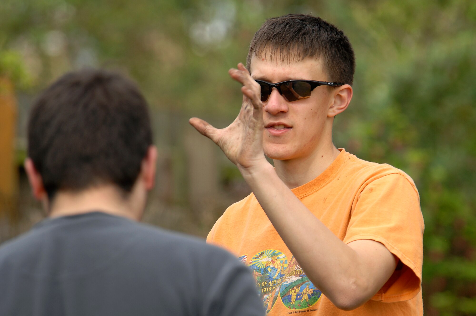 THETFORD, England -- Isaiah Roehm, Boy Scouts of America Troop 219, and project team leader, explains the next step for the day at the Raleigh Nursery and Junior School April 22, 2012.  Members from the 48th Medical Group teamed with Boy Scouts of America Troop 219 and the Lakenheath High School Junior Reserve Officer Training Corps to clean-up a gardening area, construct gardening boxes and install a water collection system.  The garden was officially reopened April 24, 2012.  (U.S. Air Force photo by Tech. Sgt. Lee A. Osberry Jr.)