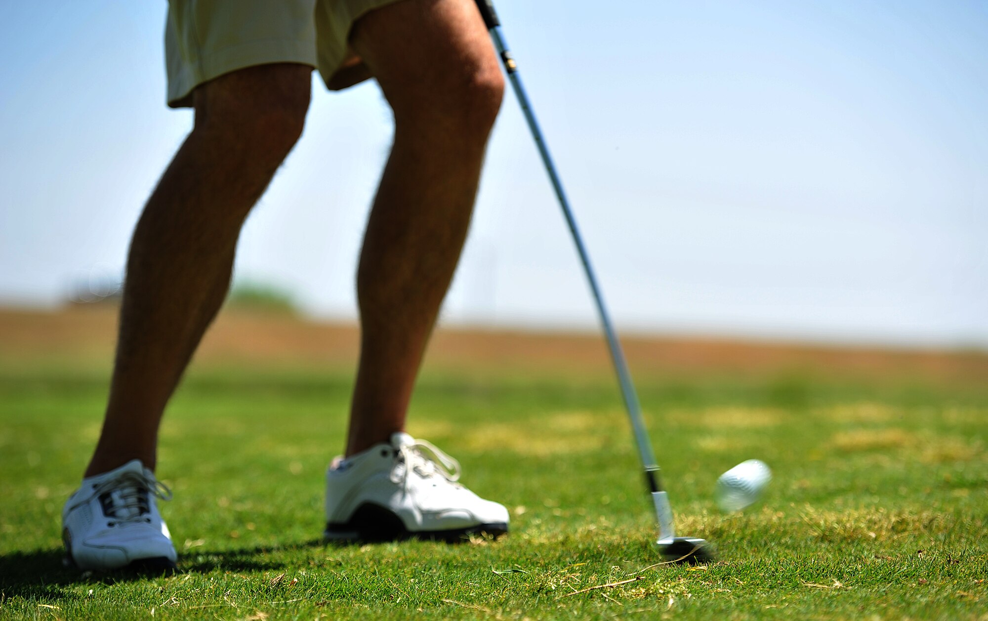 SAN ANGELO, Texas-- An Air Force Sergeants Association member strikes a golf ball with a club at Quicksand Golf Course April 27. The AFSA members came together for a golf tournament fundraiser. (U.S. Air Force photo/ Airman 1st Class Michael Smith)