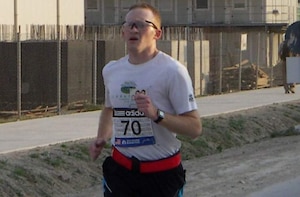 U.S. Air Force Maj. Anthony J. Agbay, deployed from Langley Air Force Base, Va., runs in the Boston Marathon Military Shadow Run in Bagram, Afghanistan, April 16. 2012. He finished sixth out of about 300 starters. (Courtesy Photo)