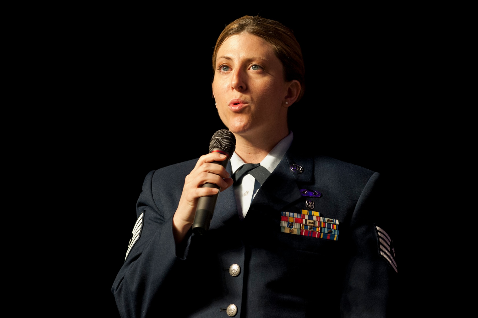 Tech. Sgt. Cortney A.P. Rogers, sings the National Anthem during the opening of the Executive Safety Summit in Milwaukee, Wis. April 24, 2005. The Air National Guard Safety Directorate is facilitating its annual ESS covering safety and many other critical topics for all executive leadership for the ANG. (National Guard Photo by Master Sgt. Marvin Preston/RELEASED)