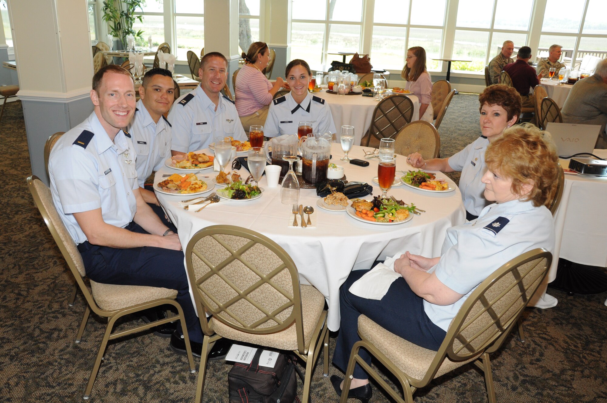Officers from the 315th Aeromedical Evacuation Squadron at Joint Base Charleston, S.C. are all smiles as they prepare to feast during the Department of South Carolina Reserve Officers Association awards luncheon April 28, 2012 at the Marine Corps Recruit Depot, Paris Island, S.C. The ROA event recognized the accomplishments of various South Carolina reserve organizations and ROA members, and the 315 AES was the recipient of the USAFR Outstanding Unit Award. (U.S. Air Force Photo/Staff Sgt. Shane Ellis)