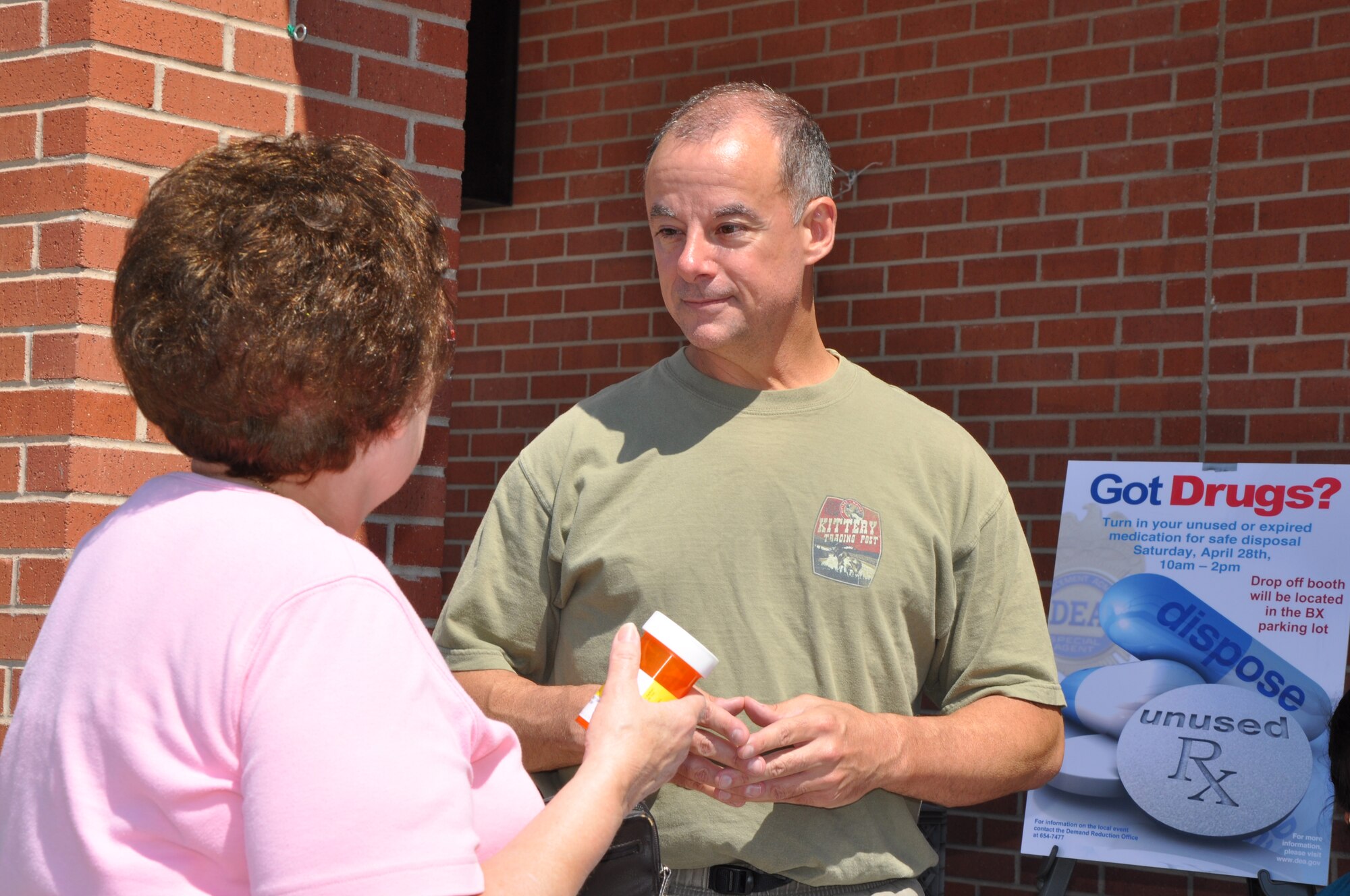 GOODFELLOW AIR FORCE BASE, Texas—Col. James Forrest, 17th Medical Group Commander, and Barbara Everidge, spouse of a retired service member, discuss the benefits of turning in expired or unused drugs during the Drug Take Back event in front of the Base Exchange April 28. More than 100 Team Goodfellow members dropped-off unused drugs during the four hour event sponsored by the Drug Enforcement Agency to recognize National Drug Take Back Month. (U.S. Air Force photo/Airman 1st Class Jessica Keith) 