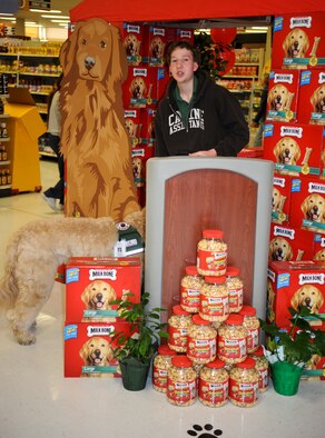 Daniel Swanson, an 18-year-old Spokane, Wash., resident and service dog recipient, describes how important receiving his new service dog from Canine Assistants is to him during an event in the commissary at Fairchild Air Force Base, Wash., April 27, 2012. Canine Assistants, a non-profit organization sponsored by Milk-Bone, a Del Monte subsidiary, and the Defense Commissary Agency along with many other agencies and corporations, has been supporting those in need for more than 12 years. (U.S. Air Force photo by Senior Airman Benjamin Stratton/Released)