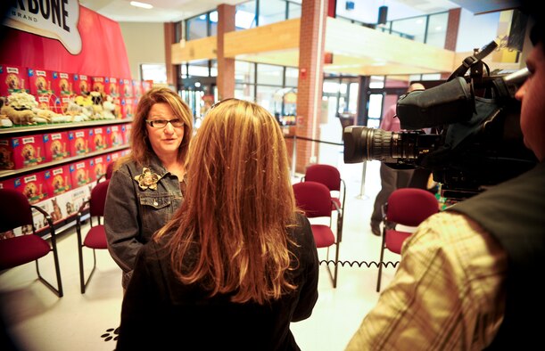 Lori Swanson, mother of Daniel Swanson, an 18-year-old Spokane, Wash., resident and service dog recipient, talks with members of the local media about how important receiving the service dog from Canine Assistants is to her family during an event in the commissary at Fairchild Air Force Base, Wash., April 27, 2012. Canine Assistants, a non-profit organization sponsored by Milk-Bone, a Del Monte subsidiary, and the Defense Commissary Agency along with many other agencies and corporations, has been supporting those in need for more than 12 years. (U.S. Air Force photo by Senior Airman Benjamin Stratton/Released)