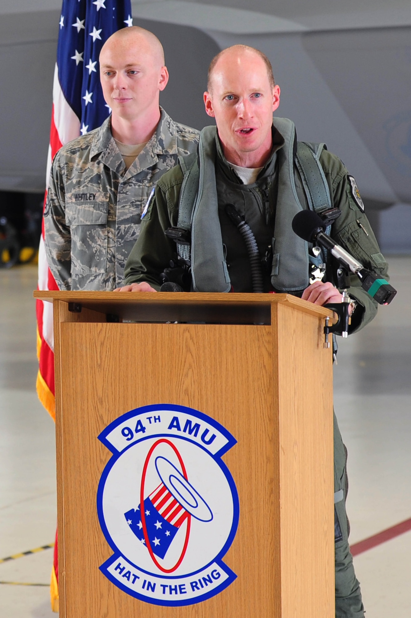 U.S. Air Force Lt. Col. Jason Hinds, 94th Fighter Squadron commander, addresses a crowd about the arrival of the final F-22 Raptor to Langley Air Force Base, Va., April 27, 2012.  The sophisticated F-22 Raptor’s aero design, advanced flight controls, thrust vectoring, and high thrust-to-weight ratio provide the capability to outmaneuver all current and projected aircraft.  (U.S. Air Force photo by Airman 1st Class Kayla Newman/Released)