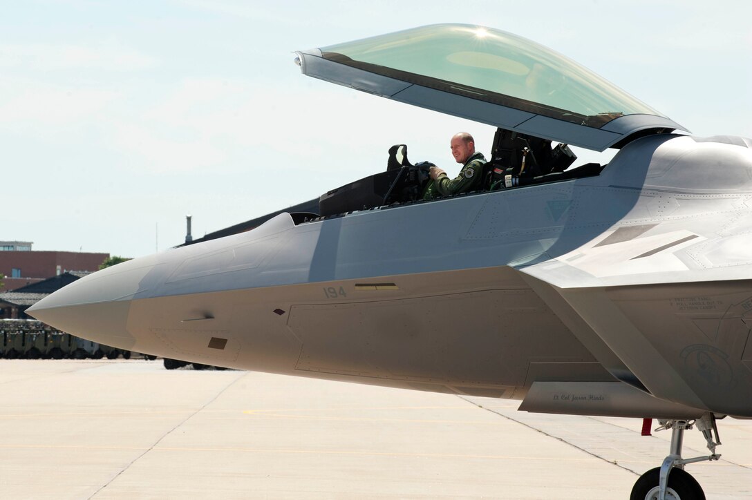 U.S. Air Force Lt. Col. Jason Hinds, 94th Fighter Squadron commander, prepares to exit the final F-22 Raptor to arrive at Langley Air Force Base, Va., April 27, 2012.   The F-22 Raptor performs both air-to-air and air-to-ground missions, allowing full realization of operational concepts vital to the 21st century Air Force.  (U.S. Air Force photo by Airman 1st Class Kayla Newman/Released)