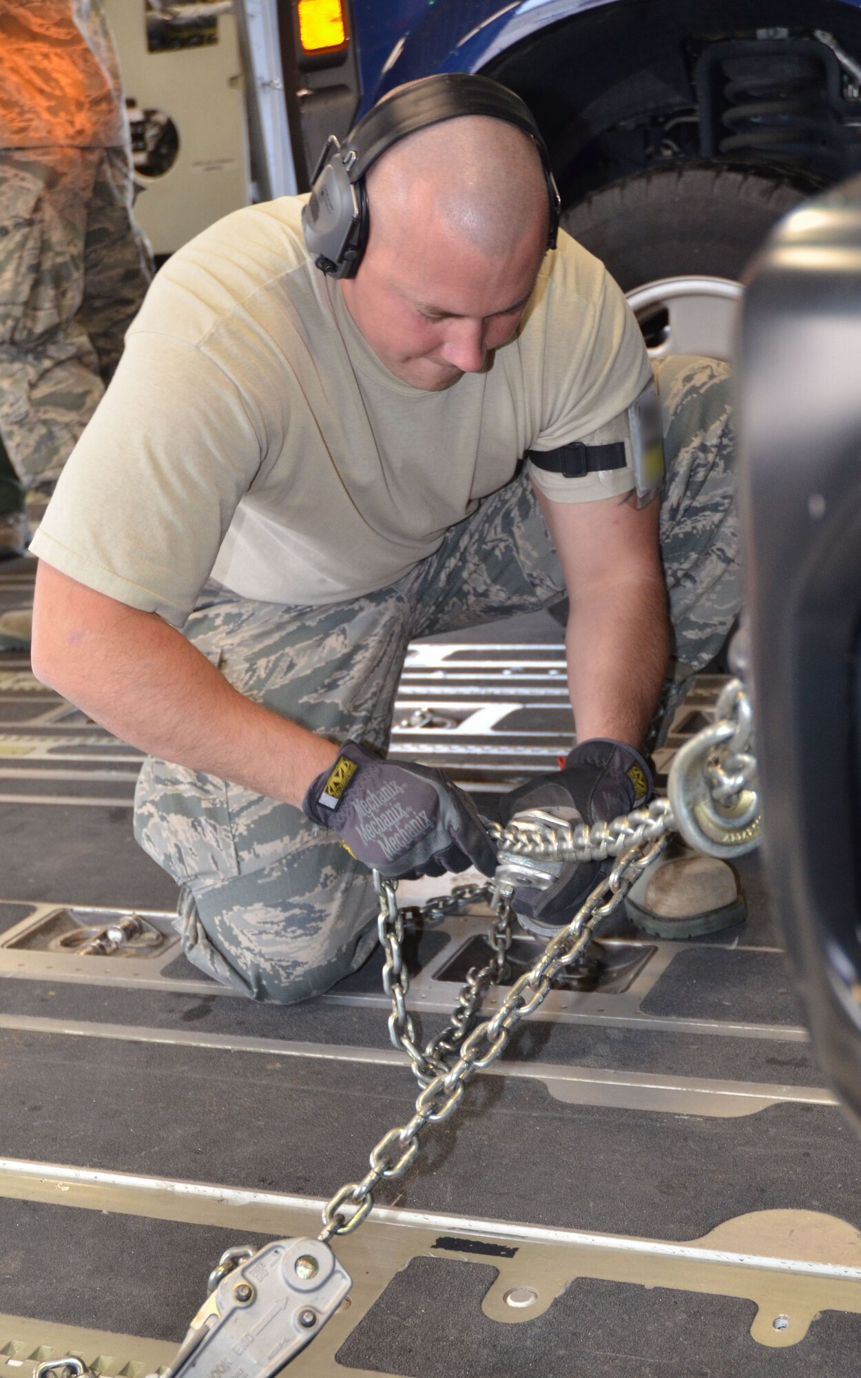 Tech. Sgt. Adam Reagan, 46th Aerial Port Squadron, secures cargo to a C-17 April 26, 2012, at Dover Air Force Base, Del. Reagan was one of 10 aerial porters who participated in Patriot Sands, an air mobility exercise, at MacDill AFB, Fla., and Patrick AFB, Fla., April 26 ? 29, 2012. Reservists with the 512th Airlift Control Flight, Dover AFB, 452nd ALCF, March Air Reserve Base, Calif., and 439th ALCF, Westover ARB, Mass., joined up with FBI Rapid Deployment Teams as part of the four day training event. (U.S. Air Force photo by Capt. Marnee A.C. Losurdo)