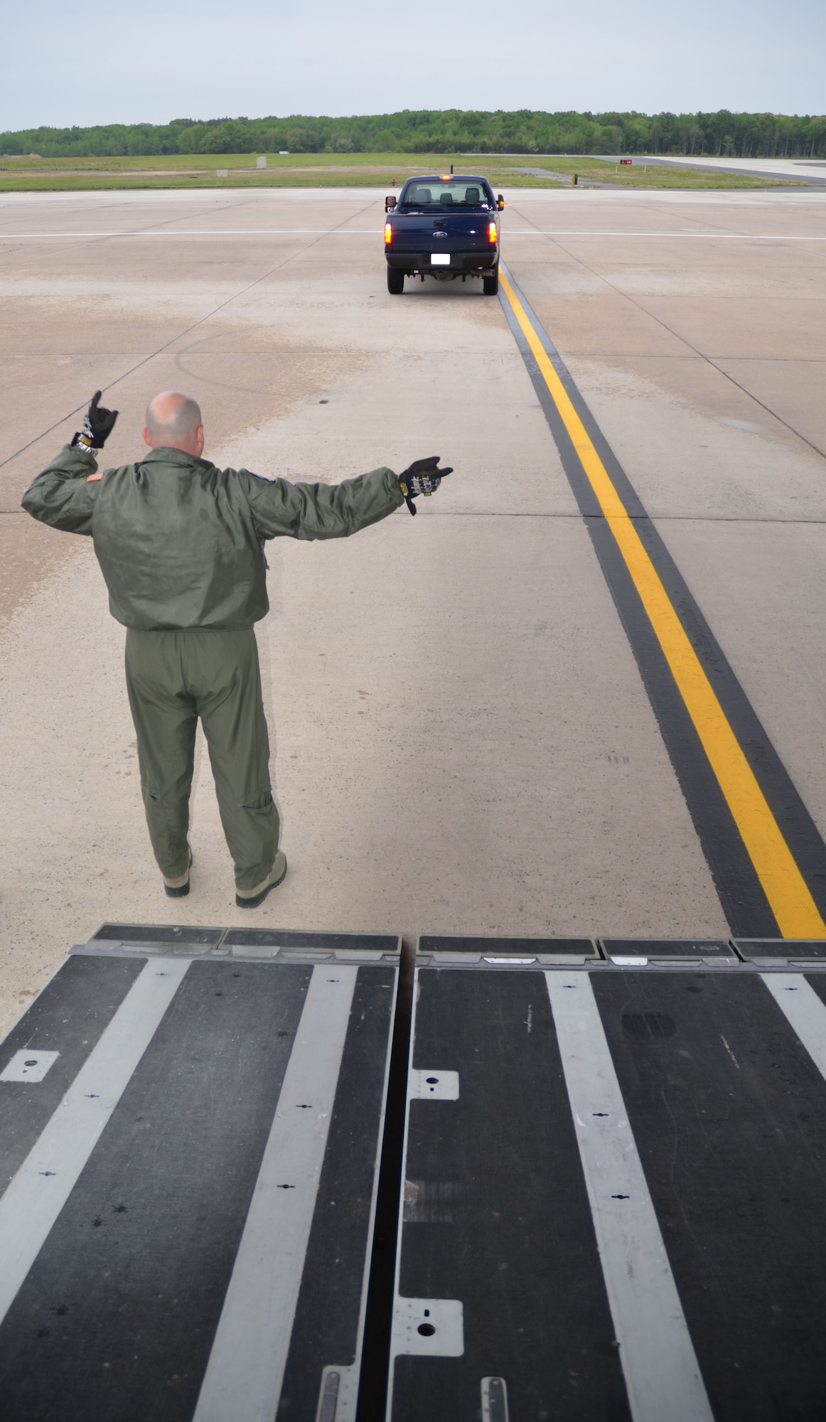 Master Sgt. Henry Fortney, 512th Airlift Control Flight loadmaster, assists with loading a truck onto a C-17 Globemaster III at Dover Air Force Base, Del., April 26, 2012 in preparation for Patriot Sands. Reservists with the 512th ALCF, 452nd ALCF, March Air Reserve Base, Calif., and 439th ALCF, Westover ARB, Mass., joined up with FBI Rapid Deployment Teams as part of Patriot Sands, an airlift exercise, at MacDill AFB, Fla., and Patrick AFB, Fla., April 26-29, 2012. (U.S. Air Force photo by Capt. Marnee A.C. Losurdo)