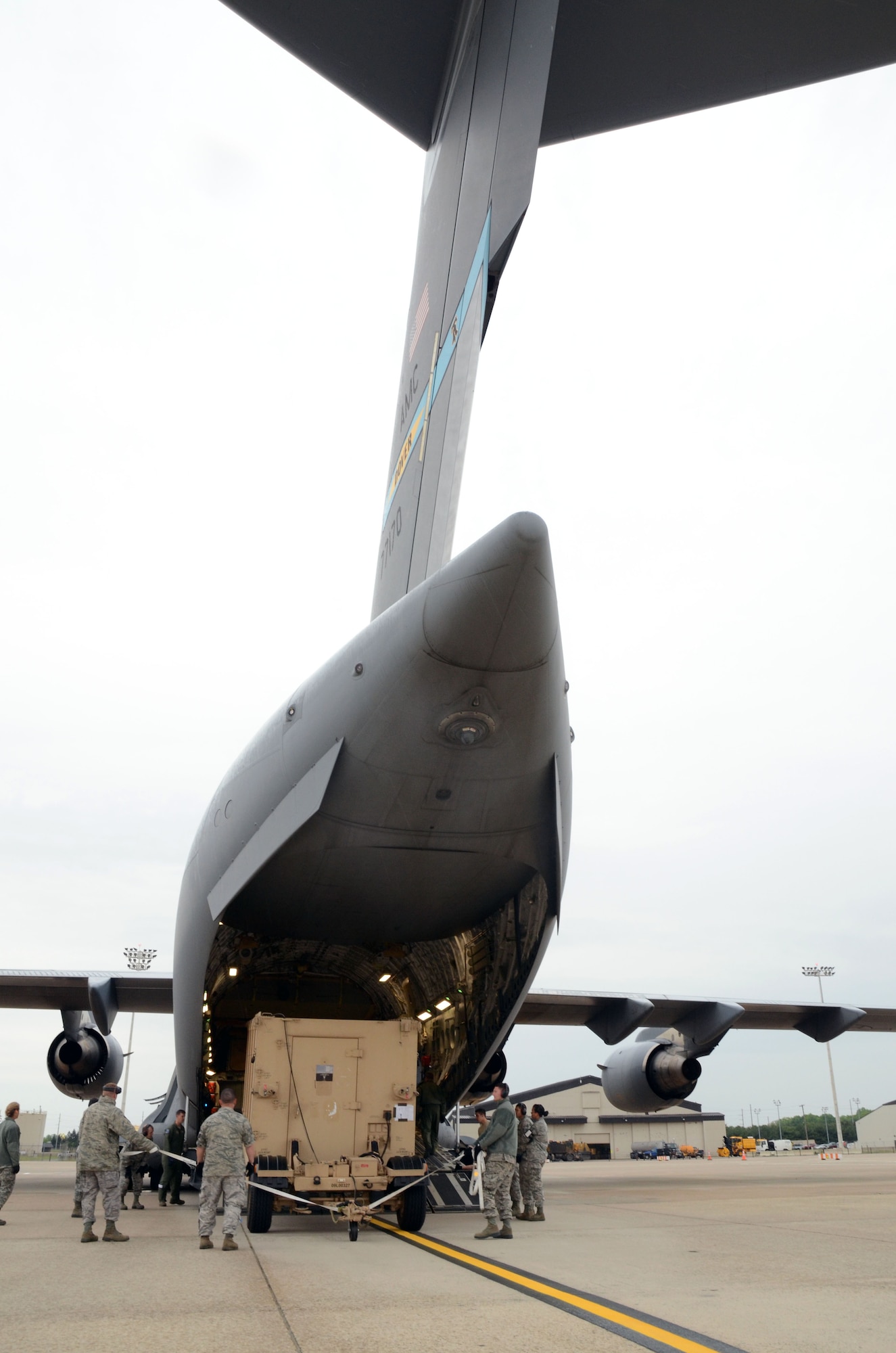 Reservists with the 512th Airlift Control Flight, Dover Air Force Base, Del., load their mobile command post onto a C-17 at Dover AFB April 26, 2012. Airlift Control Flights deploy with a communications package called the Hardside Expandable Light Air Mobile Shelter, referred to as a HELAMS. The unit, along with the 452nd ALCF, March Air Reserve Base, Calif., and 439th ALCF, Westover ARB, Mass., joined up with FBI Rapid Deployment Teams during Patriot Sands, an airlift exercise at MacDill Air Force Base, Fla., and Patrick AFB, Fla., April 26-29, 2012. (U.S. Air Force photo by Capt. Marnee A.C. Losurdo)