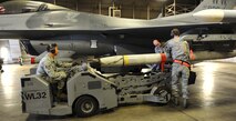 U.S. Airmen from the 35th Aircraft Maintenance squadrons unload an AGM-88 high-speed anti-radiation missile from an F-16 Fighting Falcon Aircraft during phase 1 of an operational readiness inspection at Misawa Air Base, Japan, April 28, 2012. OREs evaluate Airmen on their mission readiness in preparation for real-world deployments. (U.S. Air Force photo by Airman 1st Class Kia Atkins/Released)