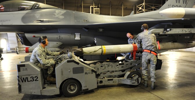 U.S. Airmen from the 35th Aircraft Maintenance squadrons unload an AGM-88 high-speed anti-radiation missile from an F-16 Fighting Falcon Aircraft during phase 1 of an operational readiness inspection at Misawa Air Base, Japan, April 28, 2012. OREs evaluate Airmen on their mission readiness in preparation for real-world deployments. (U.S. Air Force photo by Airman 1st Class Kia Atkins/Released)