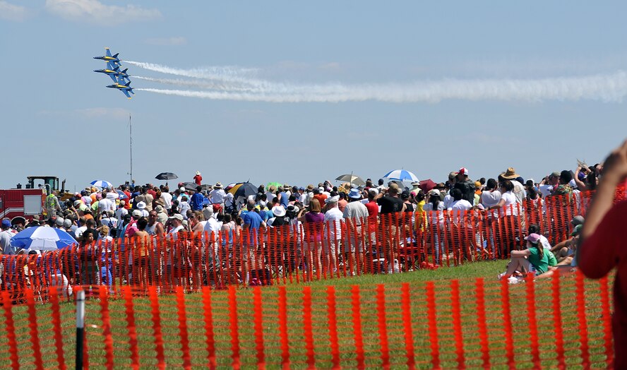 Crowds look on as the Blue Angels perform an aerial demonstration at the 2012 Robins Air Show. (U.S. Air Force photo by Tommie Horton)