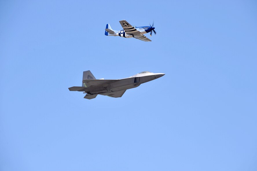 The Heritage Flight mixes the old with the new -- a side-by-side flight by the F-22 Raptor and the P-51 Mustang. The aircraft performed at the 2012 Robins Air Show. (U.S. Air Force photo by Tommie Horton)