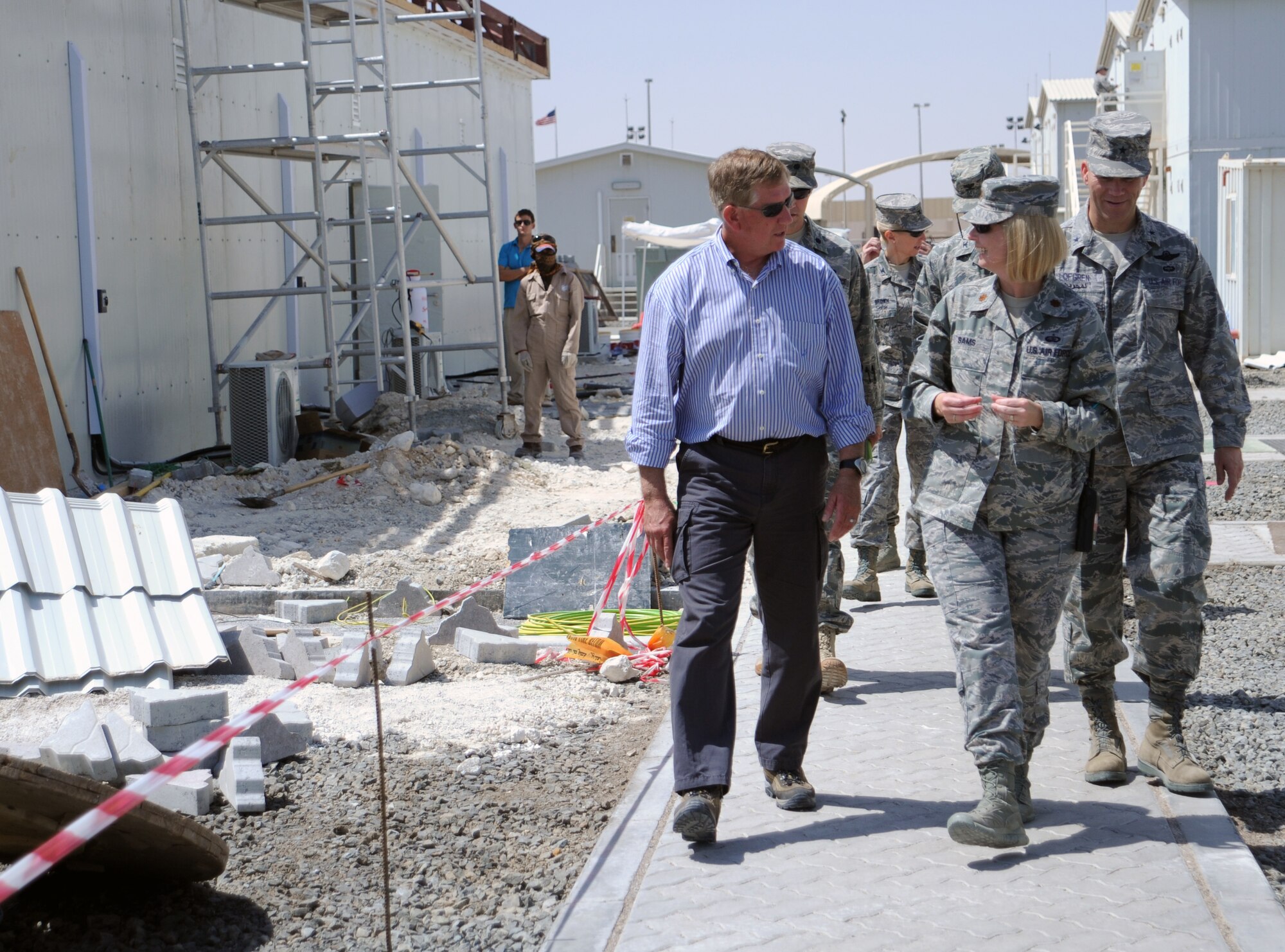 SOUTHWEST ASIA - Maj. Kelly Sams discusses future construction projects at the 380th Air Expeditionary Wing with Terry Yonkers, Assistant Secretary of the Air Force for Installations, Environment and Logistics, April 26, 2012. During his visit to the 380th AEW, Yonkers was treated to tours of the installation where he talked with Airmen about the future of the base and the Air Force. Sams is the 380th Expeditionary Force Support Squadron commander. (U.S. Air Force photo/Staff Sgt. J.G. Buzanowski)