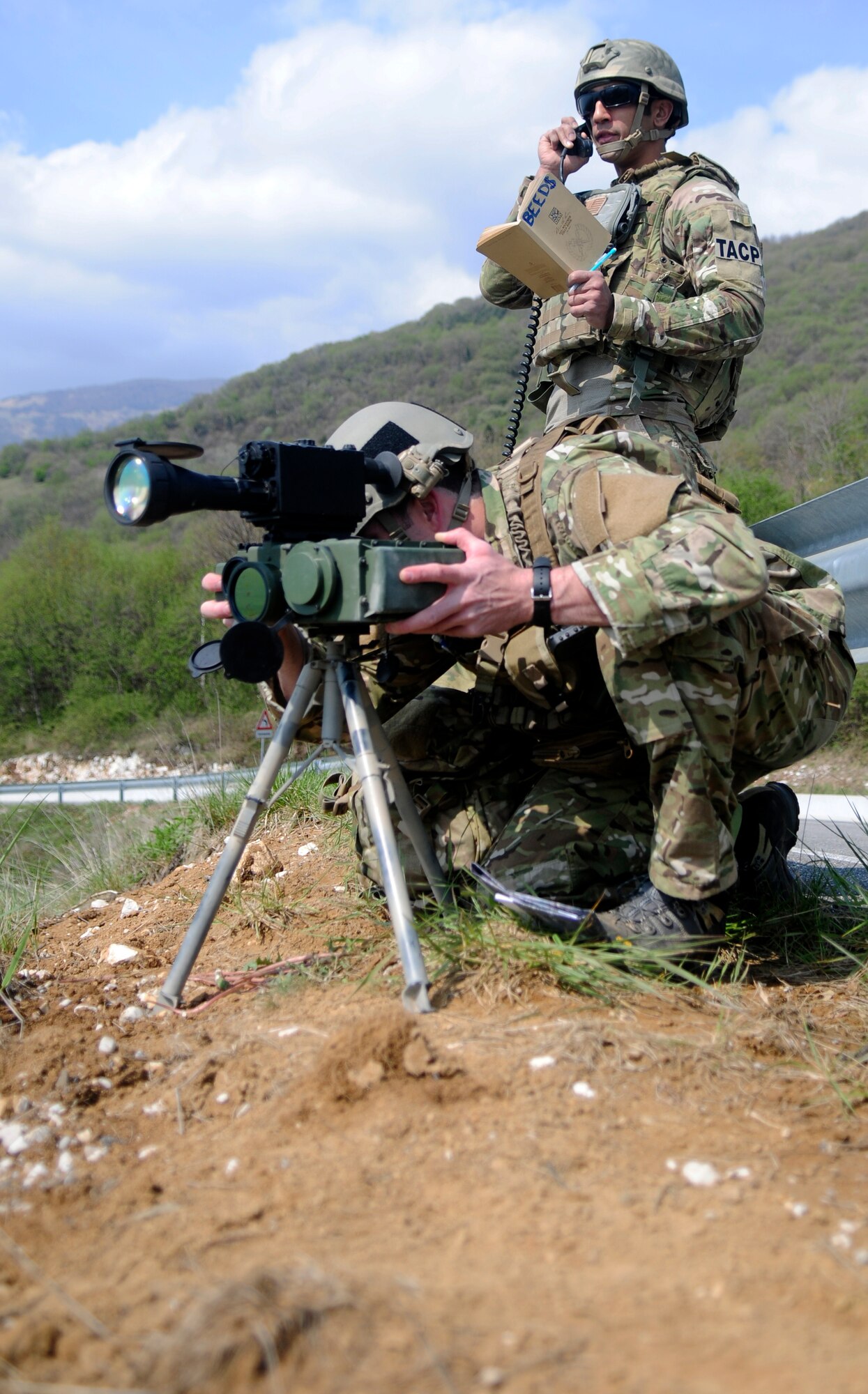 Senior Airman Nathaniel Robie and Airman 1st Class Andrew Beediahram, 8th Air Support Operations Squadron tactical air control party members, participate in an off base training mission April 18 in northern Italy. These routine training missions are designed to help TACP members develop combat-related skills such as map reading, compass usage, enemy target location, and survival, escape and evasion techniques. (U.S. Air Force photo/Airman 1st Class Briana Jones)