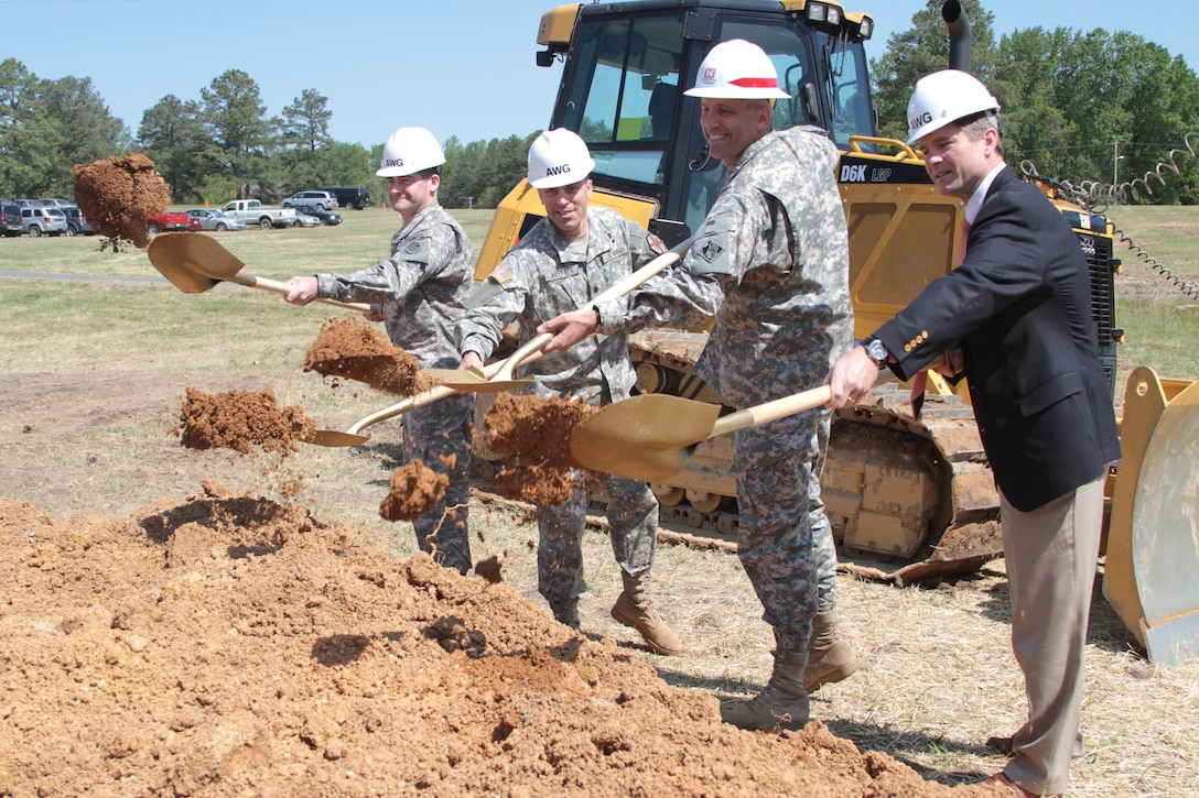 (From left to right) Col. Patrick Mahaney Jr., Lt. Col. Jack Haefner, Col. Paul Olsen and Mike McCarthy throw dirt during a groundbreaking ceremony for the new Asymmetric Warfare Group’s battle laboratory complex at Fort A.P Hill, Va.  April 25, 2012.  The $55 million dollar complex, construction of which is overseen by the Norfolk District, U.S. Army Corps of Engineers, will provide the Army with an area to test and adapt operating procedures to ever-changing wartime scenarios.  (U.S. Army photo/Patrick Bloodgood)