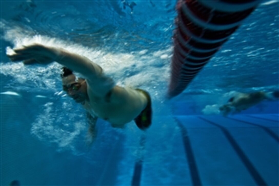 Wounded U.S. Marine Corps combat veterans swim during practice for the 2012 Warrior Games in Colorado Springs, Colo., on April 26, 2012. The Warrior Games is an annual event allowing wounded, ill and injured Service members and veterans to compete in Paralympics sports including archery, cycling, shooting, sitting volleyball, track and field, swimming and wheelchair basketball.  