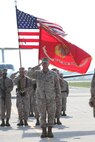 Col. Jeffrey M. Hewlett salutes during the national anthem at a change of command ceremony where he relinquished command of Marine Corps Air Station New River to Lt. Col. Mitchell E. Cassell, July 27. Hewlett retired at the ceremony after having served for more than 25 years in the United States Marine Corps.
