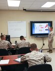 Center for Naval Aviation Technical Training Marine Unit New River instructor Sgt. Jacob T. Winchester teaches a class on aircraft auxiliary power to a group of 8 Marines in a CNATT classroom, July 17. 

