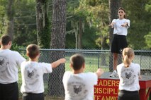Young Marines from the Young Marine program aboard Marine Corps Air Station New River conduct their daily physical training regiment, July 25. The Young Marines are participating in a weeklong encampment in Florida beginning Aug. 4. During their trip, the Young Marines will participate in various activities such as swim qualification, small-arms fire and outdoors survival.
