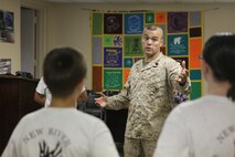 Gunnery Sgt. Michael M. Vicente motivates Young Marines from the Young Marine program aboard Marine Corps Air Station New River, July 25. Young Marines are participating in a weeklong encampment in Florida beginning Aug. 4. During their trip, the Young Marines will participate in various activities such as swim qualification, small-arms fire and outdoors survival.
