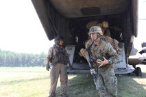 Marines from Marine Heavy Helicopter Squadron 461 exit a CH-53E Super Stallion helicopter to conduct troop insertions, exertions, and combat patrols with Royal British Marines, July 26. HMH-461 Marines flew to Marine Corps Base Quantico, Va., in support of training operations for approximately 120 U.S. Marines and 30 British Royal Marines.