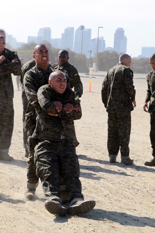Recruits of Company H, 2nd Recruit Training Battalion, conduct buddy drag exercises aboard Marine Corps Recruit Depot San Diego, July 26. The buddy drag was one segment of an obsticle course that also included rope climbing. 