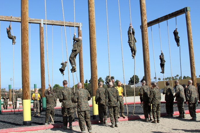 Recruits of Company H, 2nd Recruit Training Battalion, climb ropes using techniques taught by their drill instructors aboard Marine Corps Recruit Depot San Diego, July 26. Rope climbing was the last segment of an obsticle course completed by Co. H recruits. Other exercises included buddy drags and jumping over logs.