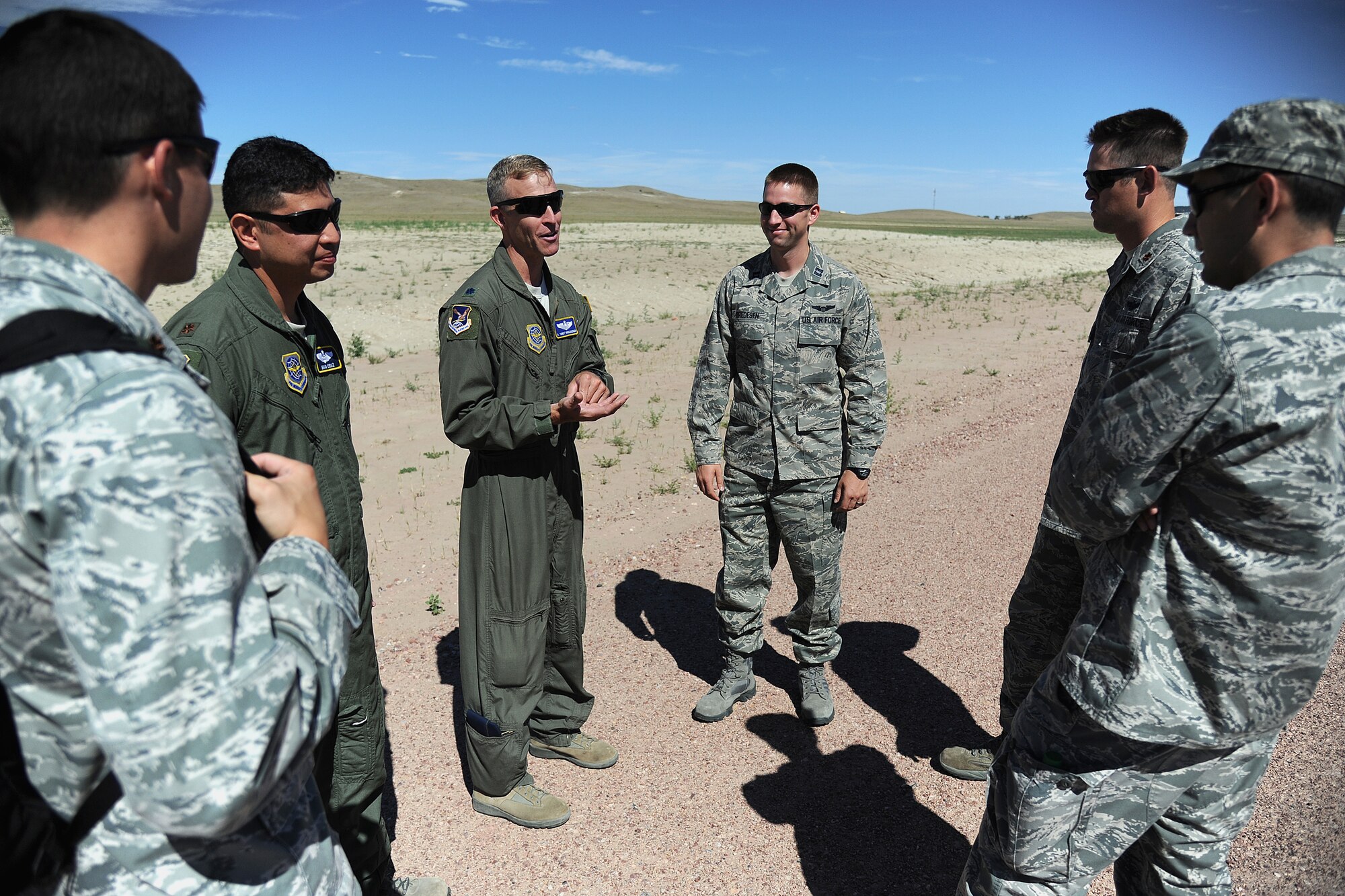 Lt. Col. Gerry Hinderberger, 615th Contingency Operations Support Group air mobility liasion officer, discusses landing zone safety during Exercise Mile High Response July 23-26, at Camp Guernsey Joint Training Center, in Guernsey, Wyo. (U.S. Air Force Photo/Tech. Sgt. Lesley Waters)