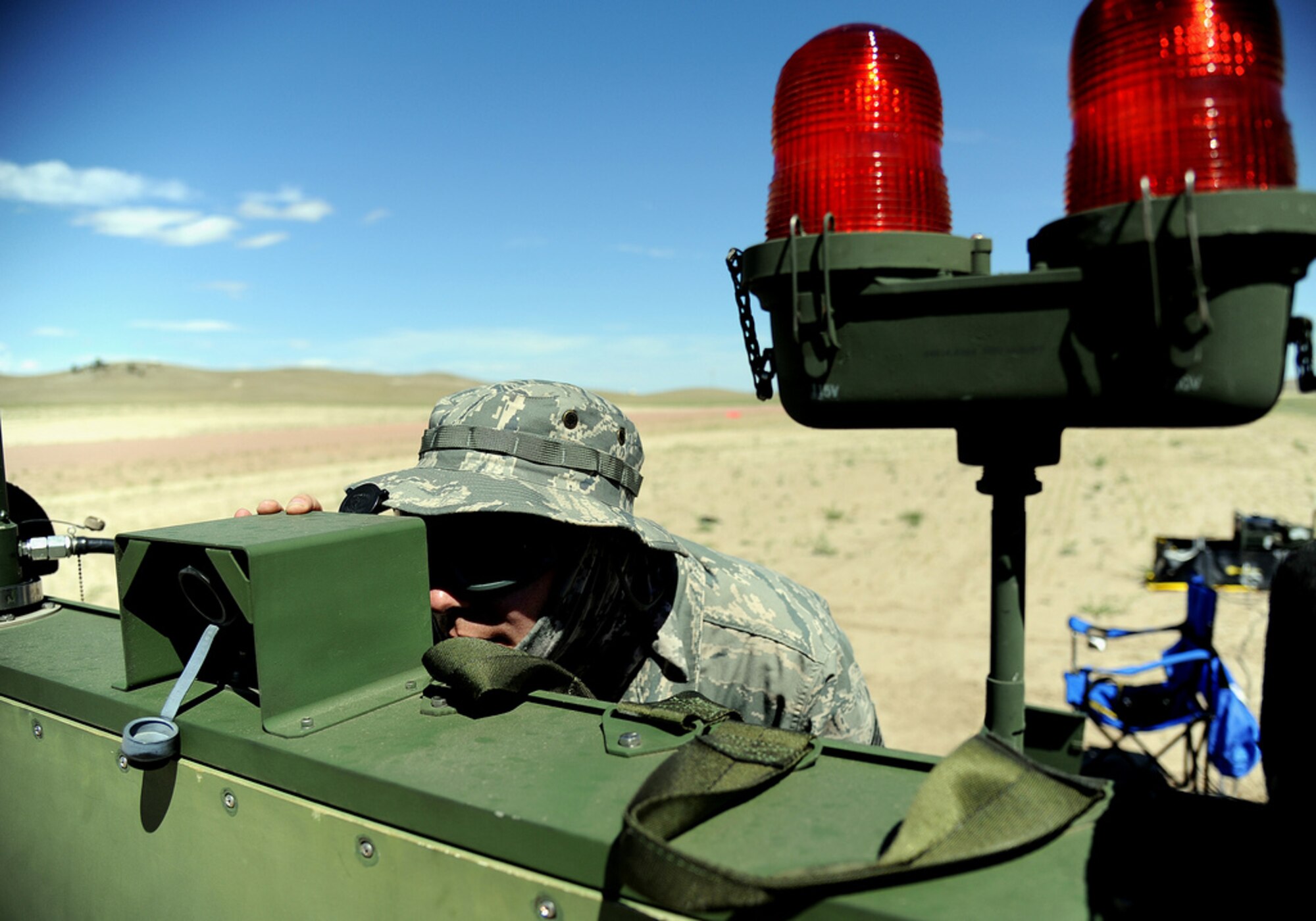 Tech. Sgt. Jason Sharp, 817th Global Mobility Readiness Squadron deployable air traffic control and landing systems NCOIC, sets up the mobile microwave landing system during Exercise Mile High Response July 23-26, at Camp Guernsey Joint Training Center, in Guernsey, Wyo. (U.S. Air Force Photo/Tech. Sgt. Lesley Waters)