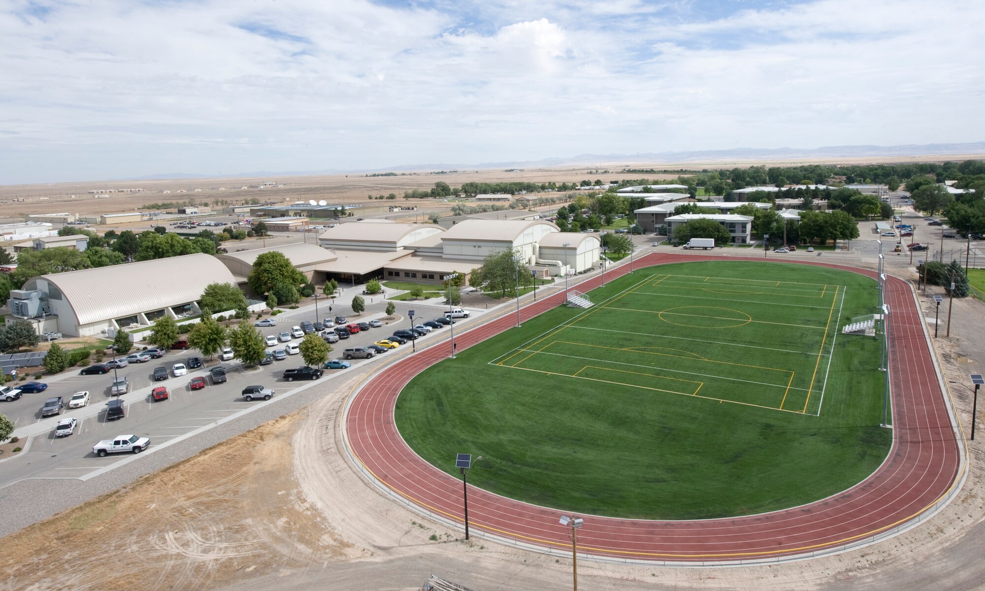 The installation of synthetic turf at the fitness center athletic field on Mountain Home Air Force Base, Idaho, was completed July 18, 2012. The improvement will save thousands of dollars and hundreds of man hours of upkeep, as well as more than a hundred thousand gallons of water. (U.S. Air Force photo/Staff Sgt. Roy Lynch)