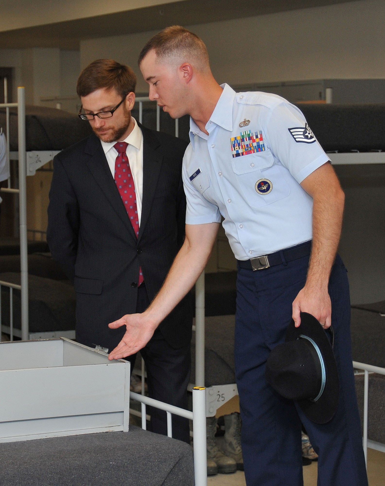 Staff Sgt. Joshua Hite provides Acting Under Secretary of the Air Force Dr.Jamie Morin an orientation of the Air Force Basic Military Training campus July 30, 2012, at Joint Base San Antonio-Lackland Air Force Base, Texas. During a visit to San Antonio, Morin met with BMT officials, toured trainee living quarters, and talked with current trainees.  Hite is a military
training instructor who has earned "Blue Rope" status, an honor bestowed on the top 10 percent of military training instructors at BMT.  (U.S. Air Force photo/Alan W. Boedeker)
