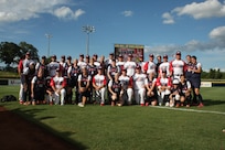 Steve Shortland (far left, back row), Air Force retiree and head coach of the USA men's softball team, is pictured with the men's and women's USA softball teams at the Border Battle in Oklahoma City, Okla., in 2010. 