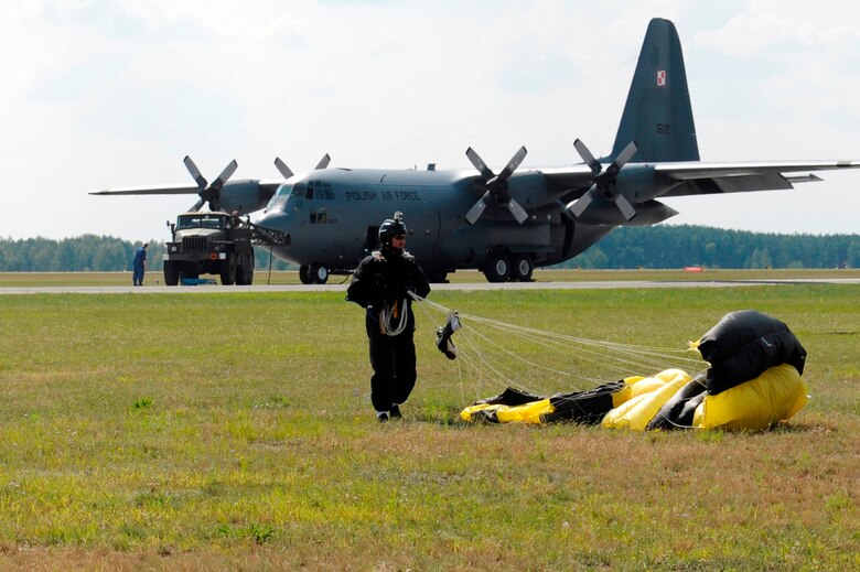 Members of Polish special forces land during high-altitude, low-opening jumps with Air Force jumpmasters during Exercise Screaming Eagle IV in Povidz, Poland, July 30, 2012. The partnerships built between Poland and the U.S. during this exercise and others have paved the way for a new aviation detachment to be established in Poland to support quarterly joint training exercises with F-16 Fighting Falcons and C-130 Hercules aircraft. (U.S. Air Force photo/Senior Airman Aaron-Forrest Wainwright)