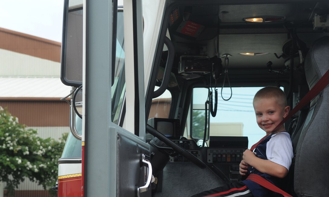 Brandon Bickel, 7, son of Jackie Bickel, sits in a fire engine during Operation: Hero at Langley Air Force Base, Va., Aug. 1, 2012. Mrs. Bickel said this event was a great opportunity for her son to learn about what his father does for the U.S. Air Force. (U.S. Air Force photo by Senior Airman Jarad A. Denton/Released)