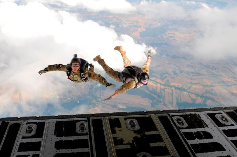 Master Sgt. Ed Dawejko and Staff Sgt. Brandon Fountain jump from a C-130J Super Hercules for high-altitude, low-opening jumps with Polish special forces during Exercise Screaming Eagle IV in Povidz, Poland, July 30, 2012. Screaming Eagle is an annual exercise that allows pilots from the 37th Airlift Squadron to conduct training with the C-130J Super Hercules aircraft while facilitating training for several other units. Dawejko is a 603rd Air Operation Center jumpmaster and Fountain is a 435th Contingency Readiness Group survive, evade, resist, escape specialist. (U.S. Air Force photo/Senior Airman Aaron-Forrest Wainwright)