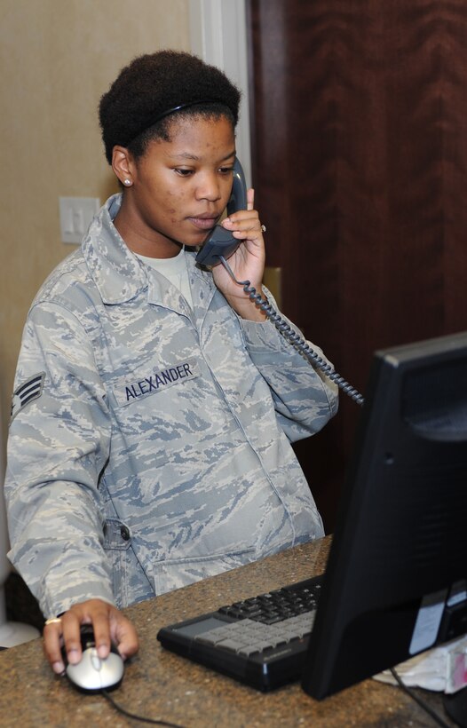 U.S. Air Force Senior Airman Dara Alexander, 633rd Force Support Squadron services specialist, speaks with a Langley Inn customer to help with reservations, July 31, 2012, at Langley Air Force Base, Va. While Alexander joined the Air Force for many reasons, her primary motivation was to be part of something bigger than herself. (US Air Force photo by Airman 1st Class R. Alex Durbin/Released)