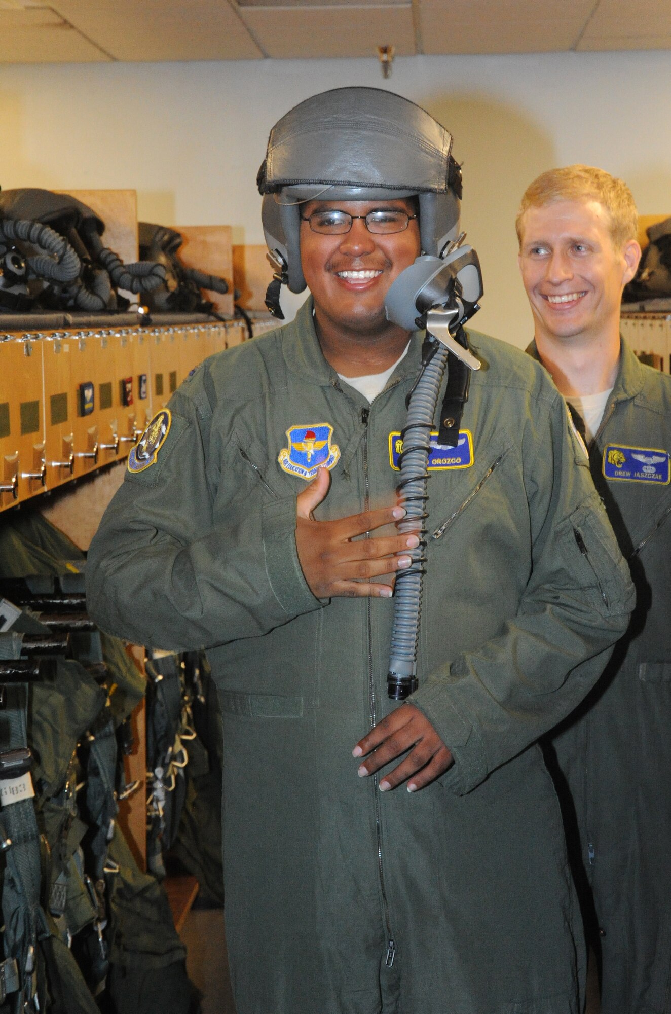 Juan Orozco Jr. smiles after trying on a flight helmet and mask during a tour of the 85th Flying Training Squadron at Laughlin Air Force Base, Texas, as the honorary pilot for a day July 23, 2012. The Pilot for a Day Program benefits local children with serious to life-threatening illnesses and their families by having a day completely devoted to them. (U.S. Air Force photo/Jose Mendoza)