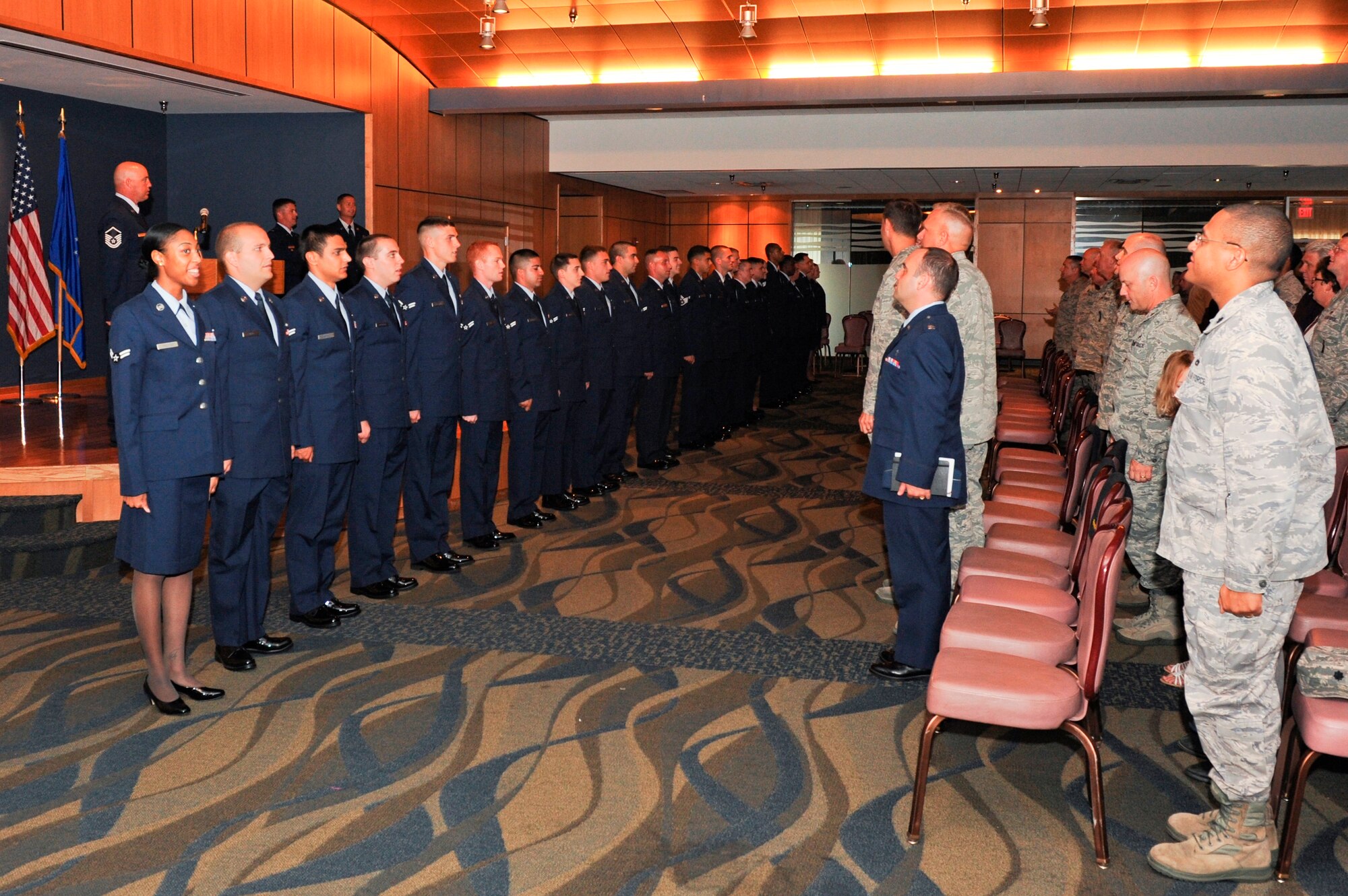 Team Tyndall Airmen celebrate August promotions in a ceremony July 31 at the Horizons Activity Center. (U.S. Air Force photo by Chris Cokeing)